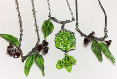 Turning over a new leaf neckpieces, silver and glass